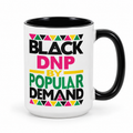 White DNP mug with pink lettering and black handle